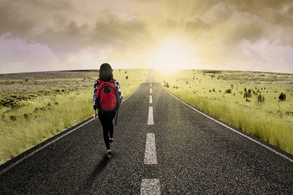 Female college student walk on the road to start her journey and gain bright future